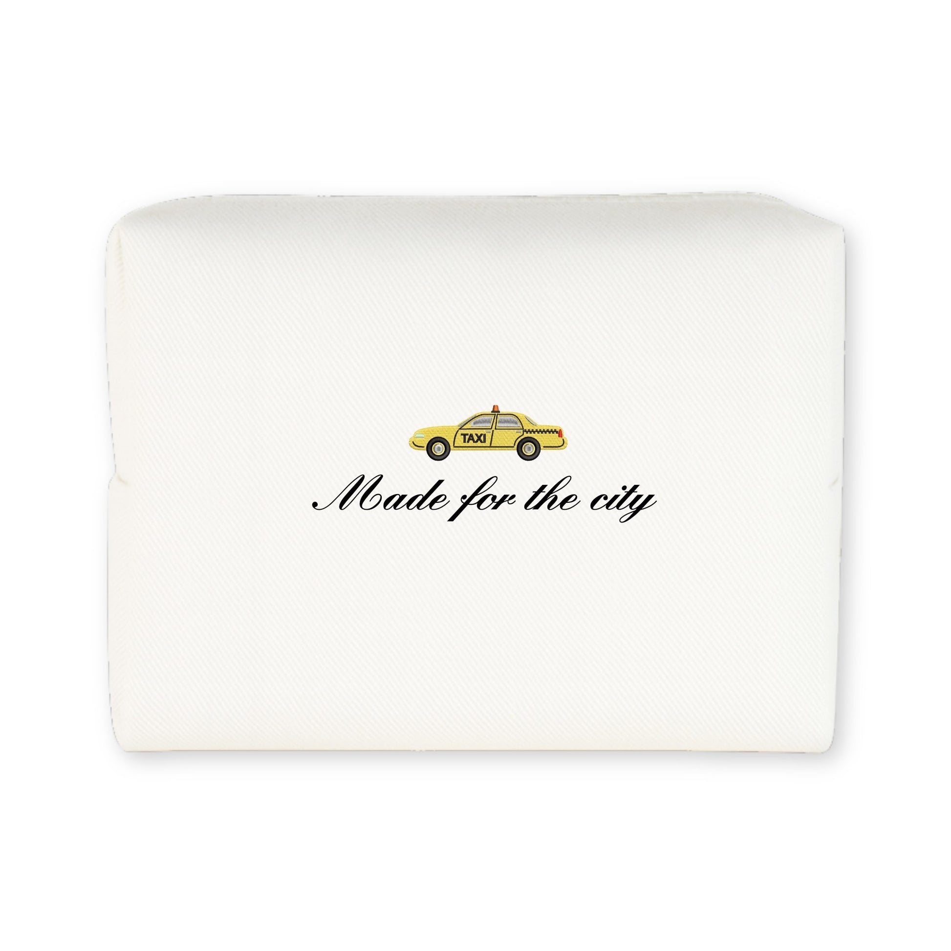White urban-themed pillow featuring a yellow taxi graphic and 'Made for the city' text.