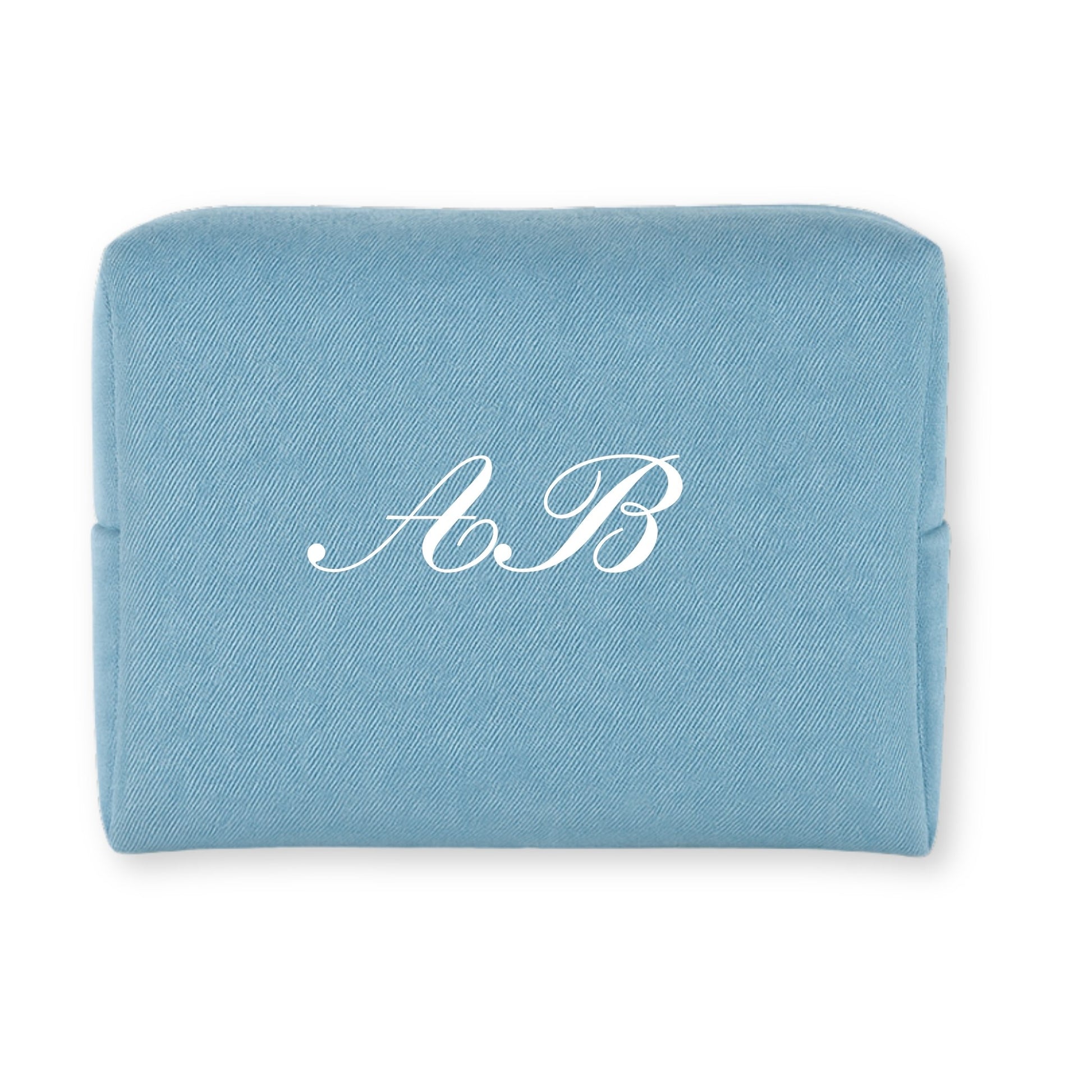 Personalized blue cosmetic pouch made of durable fabric with elegant white initials A.B.