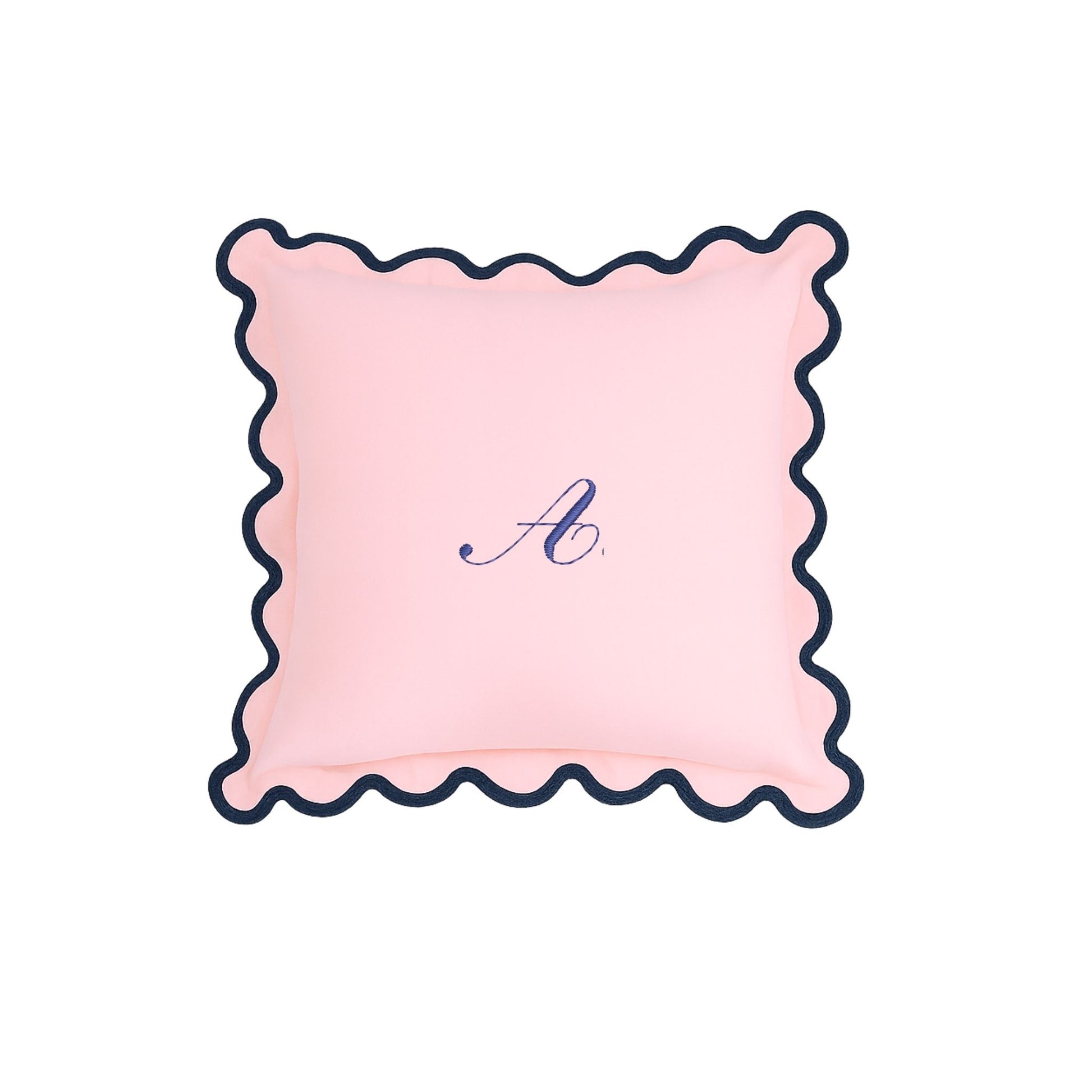 Pink pillow with scalloped edge and monogram 'A' on a white background