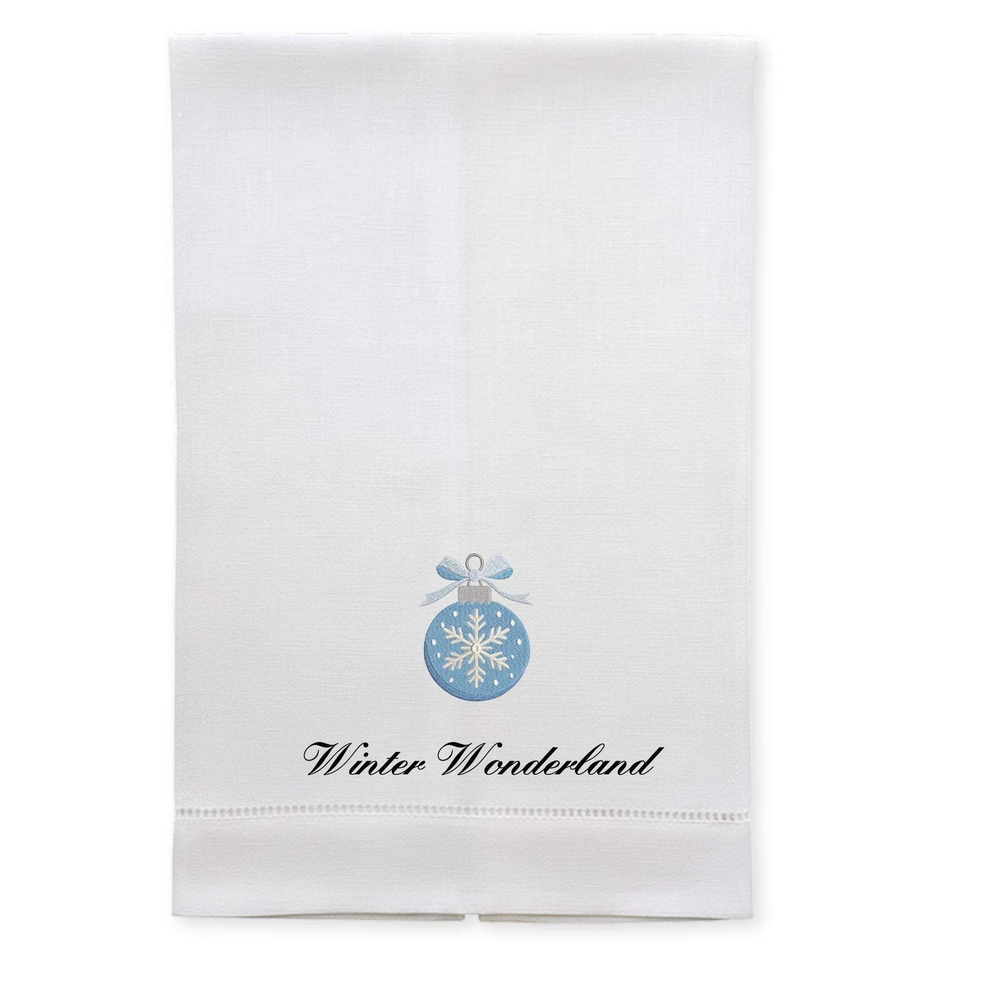 White holiday kitchen towel featuring blue snowflake ornament design and 'Winter Wonderland' text.