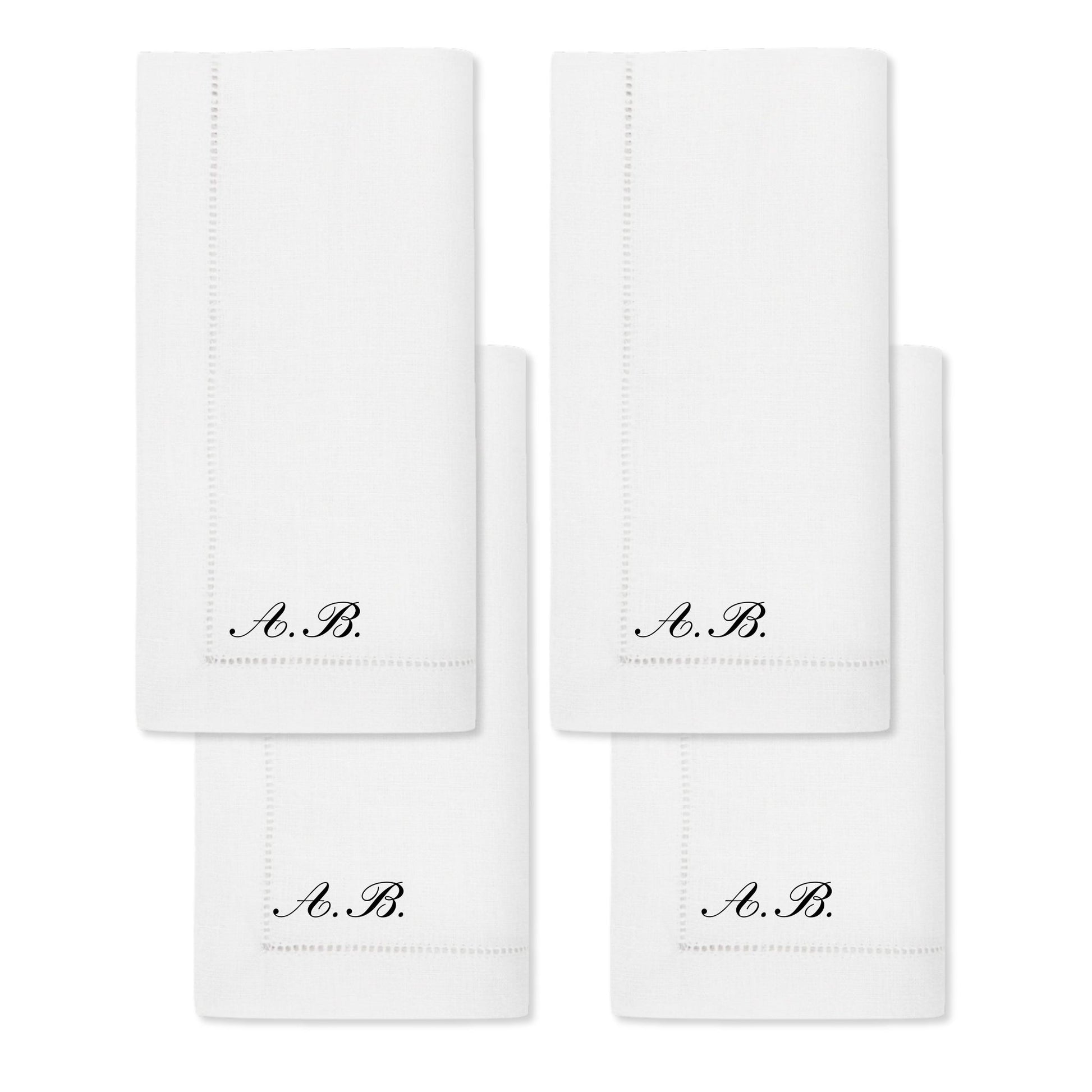 Set of 4 white linen napkins with elegant black A.B. monogram embroidery.